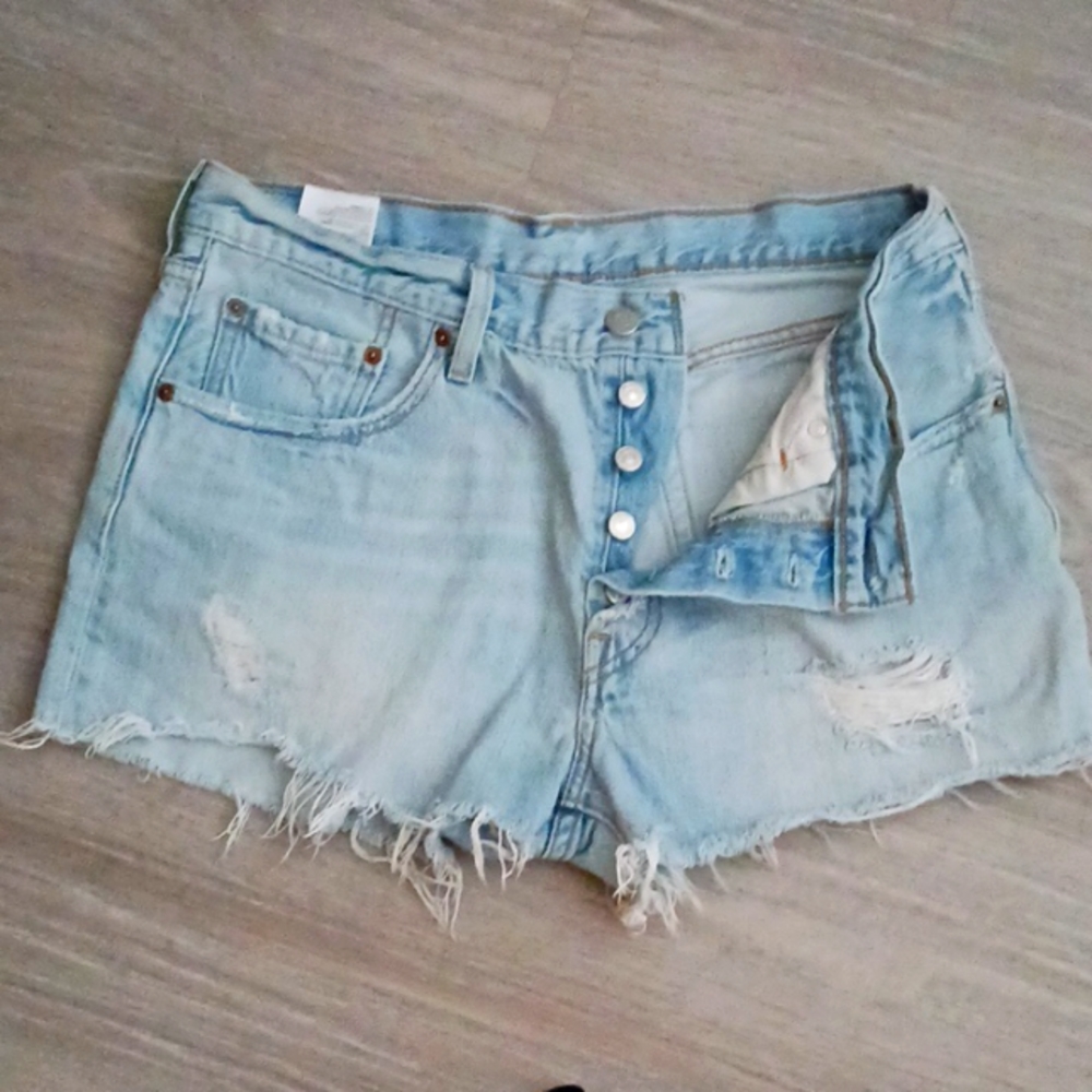 Levi shorts cut offs 501s small hole in the cheek distressed on the front button
